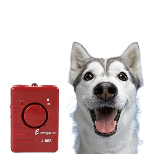 A red ultrasonic dog repeller flashlight with a button on the front, displayed alongside a large white dog with a collar.