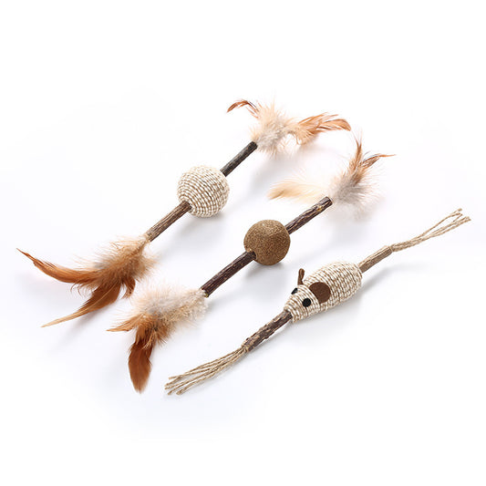 A set of cat toys made with wood, hemp rope, and feathers.