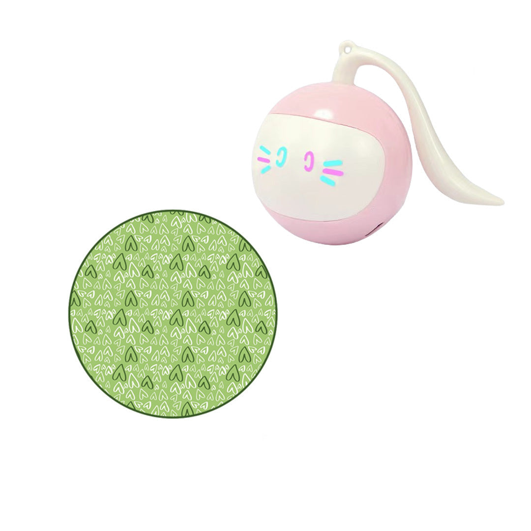 The image shows a cat interacting with a pink hunting cover and a green hunting cover, along with a USB-powered electric toy ball.