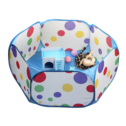 Colorful polka dot pet playpen with a small house and toy inside on a white background