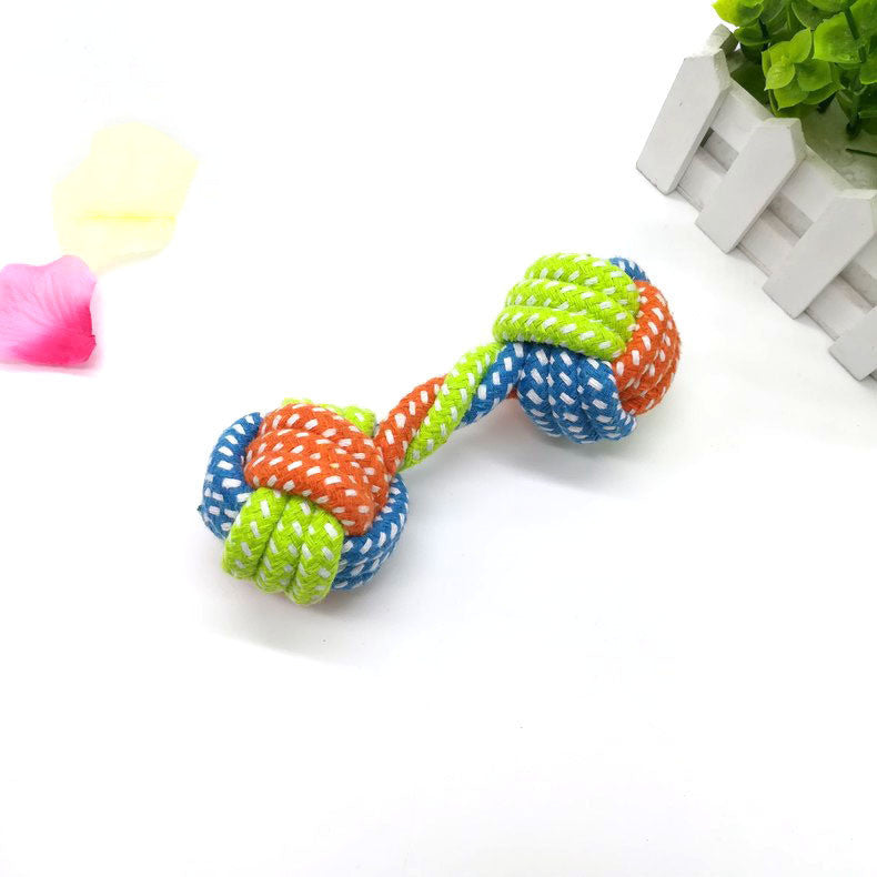 Dog bites cotton rope toy