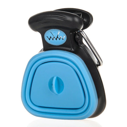 The image shows a foldable dog pooper scooper in blue color with a package of waste bags. There is also a person demonstrating the use of the scooper with a waste bag.