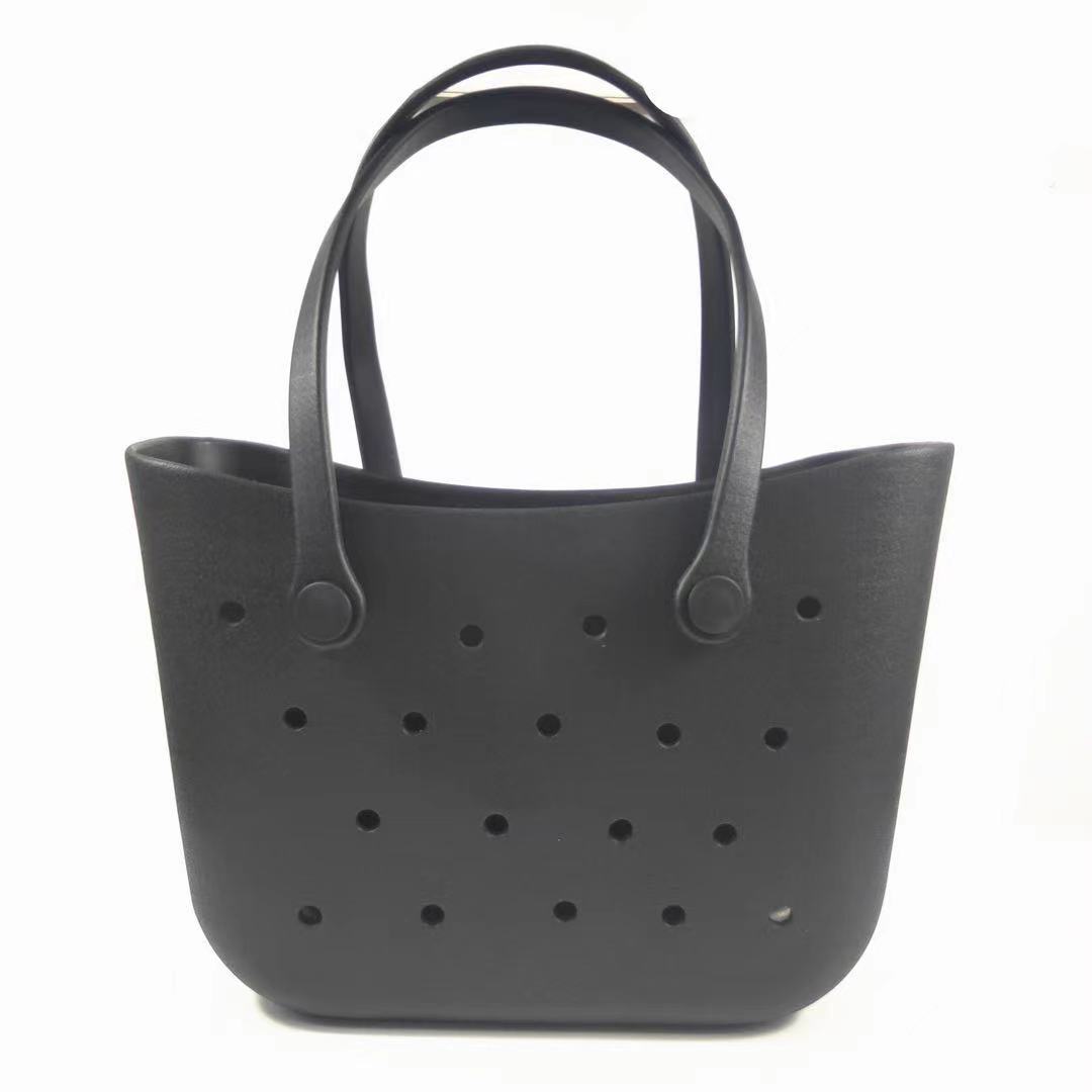 Black perforated tote bag on a white background