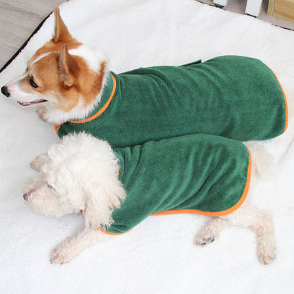 Two dogs wearing green microfiber pet towels with adjustable straps. One is a small white dog and the other is a larger brown and white dog.
