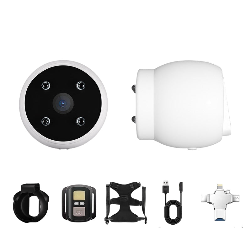 A white fluffy dog wearing a blue harness equipped with a pet recorder camera.